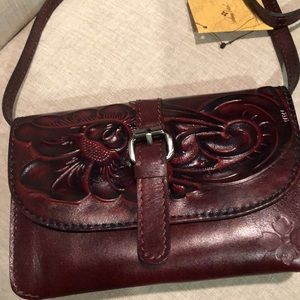Patricia Nash NWT beautiful cross body bag.  Burgundy rich color.